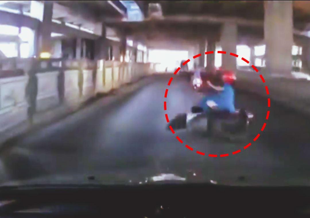 Woman falls off scooter after hitting pothole in Bengaluru National